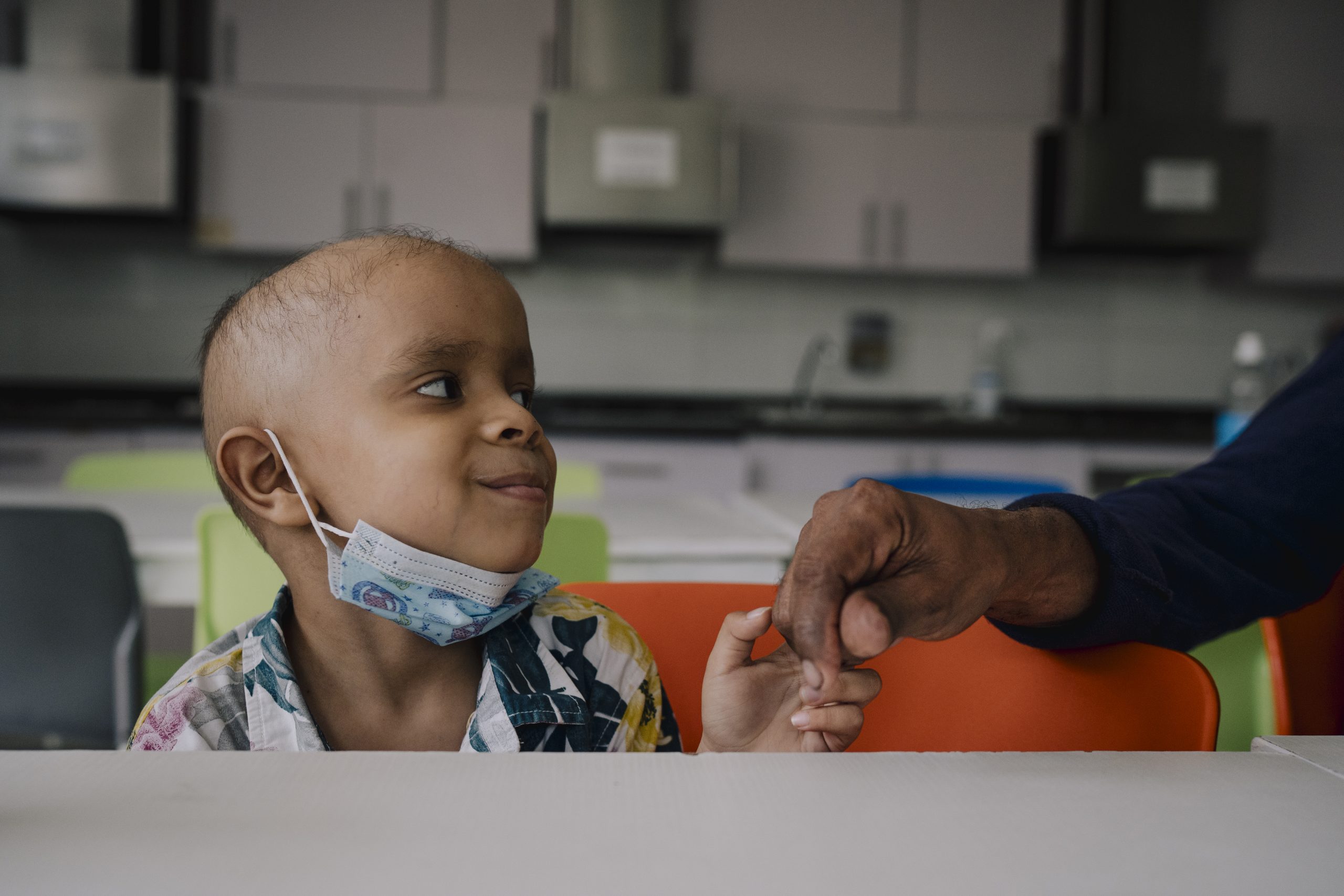 Smiling Child Holding Hand